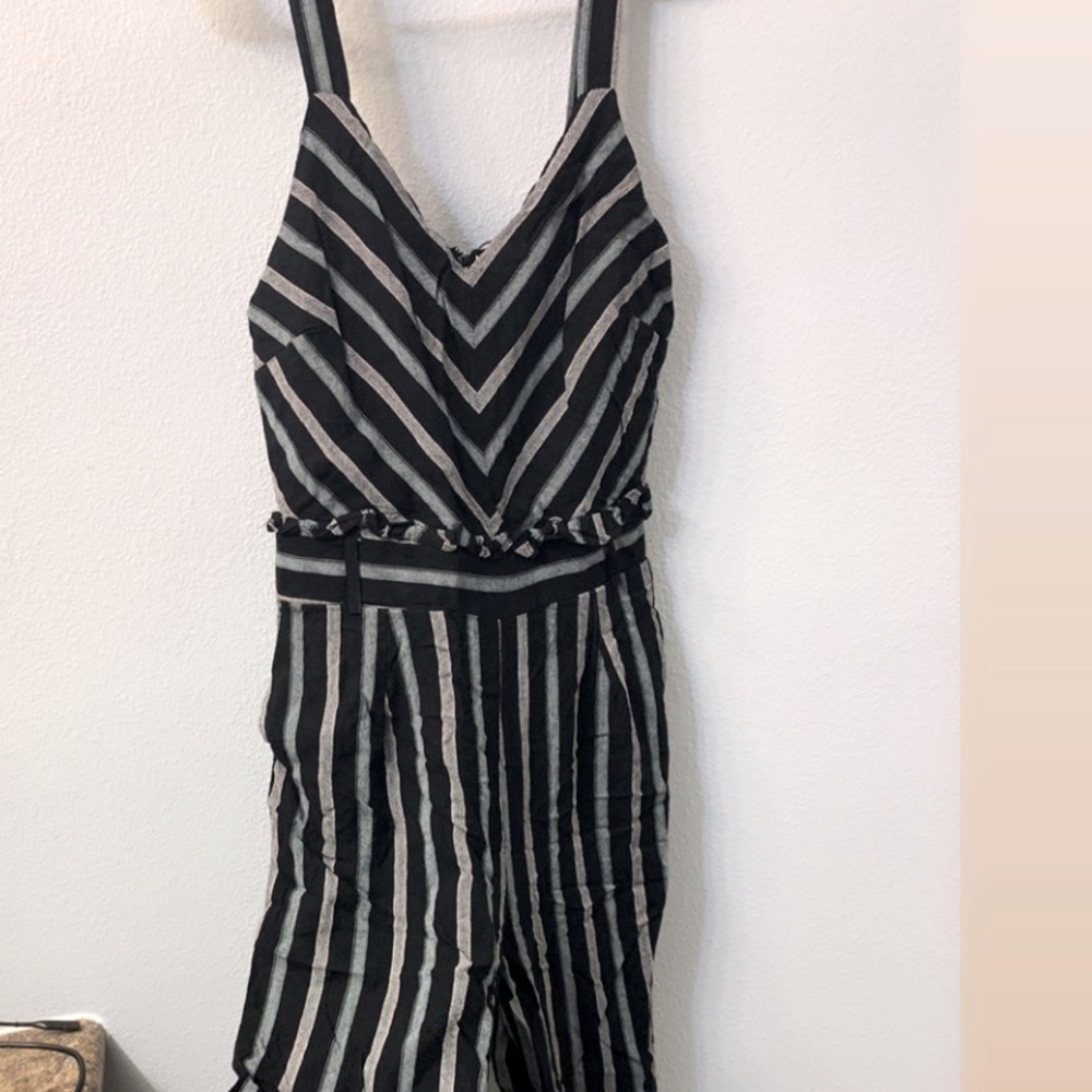 Black romper with ruffle detail